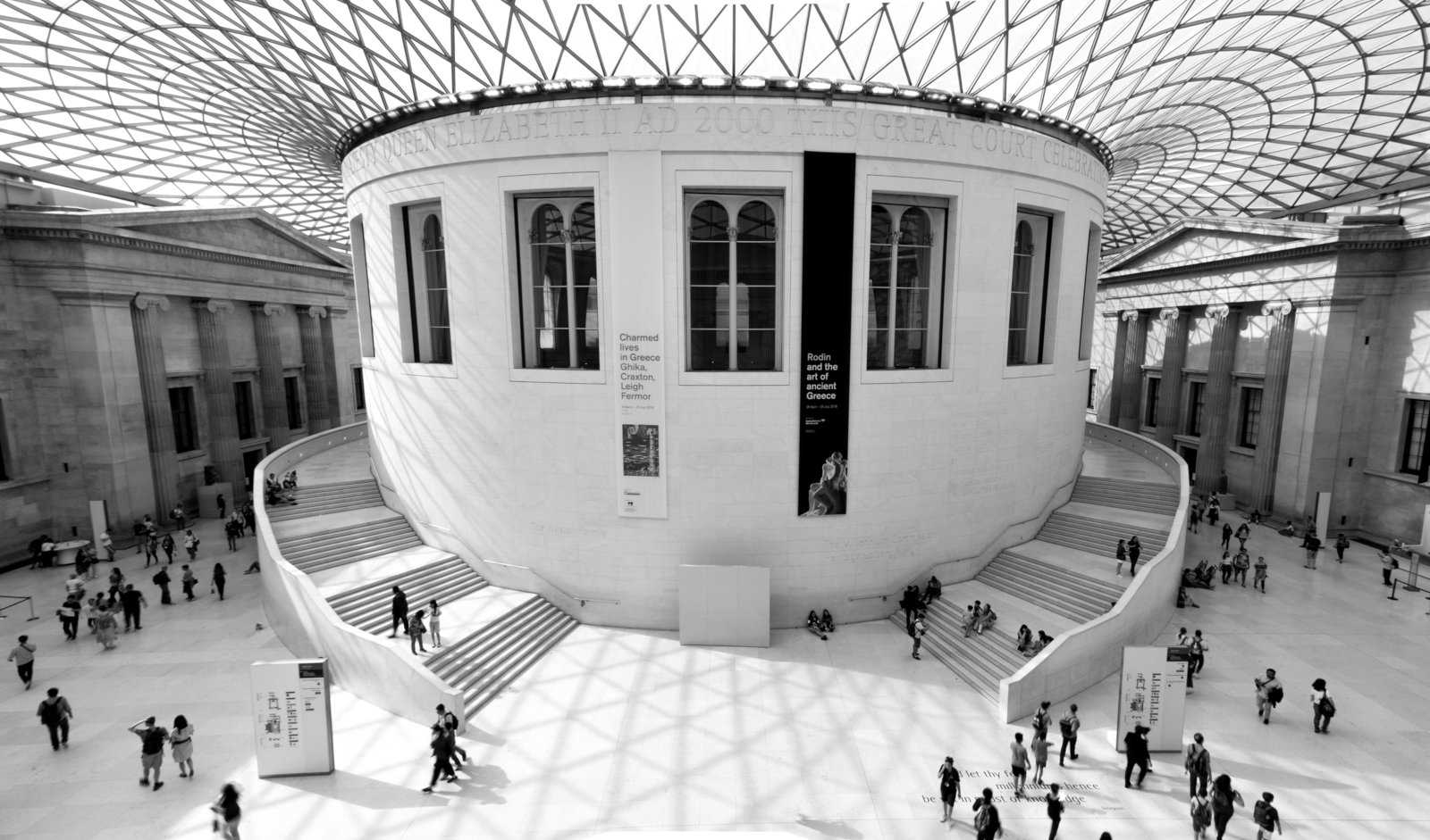 A black and white shot of the main foyer inside the British Museum in London.