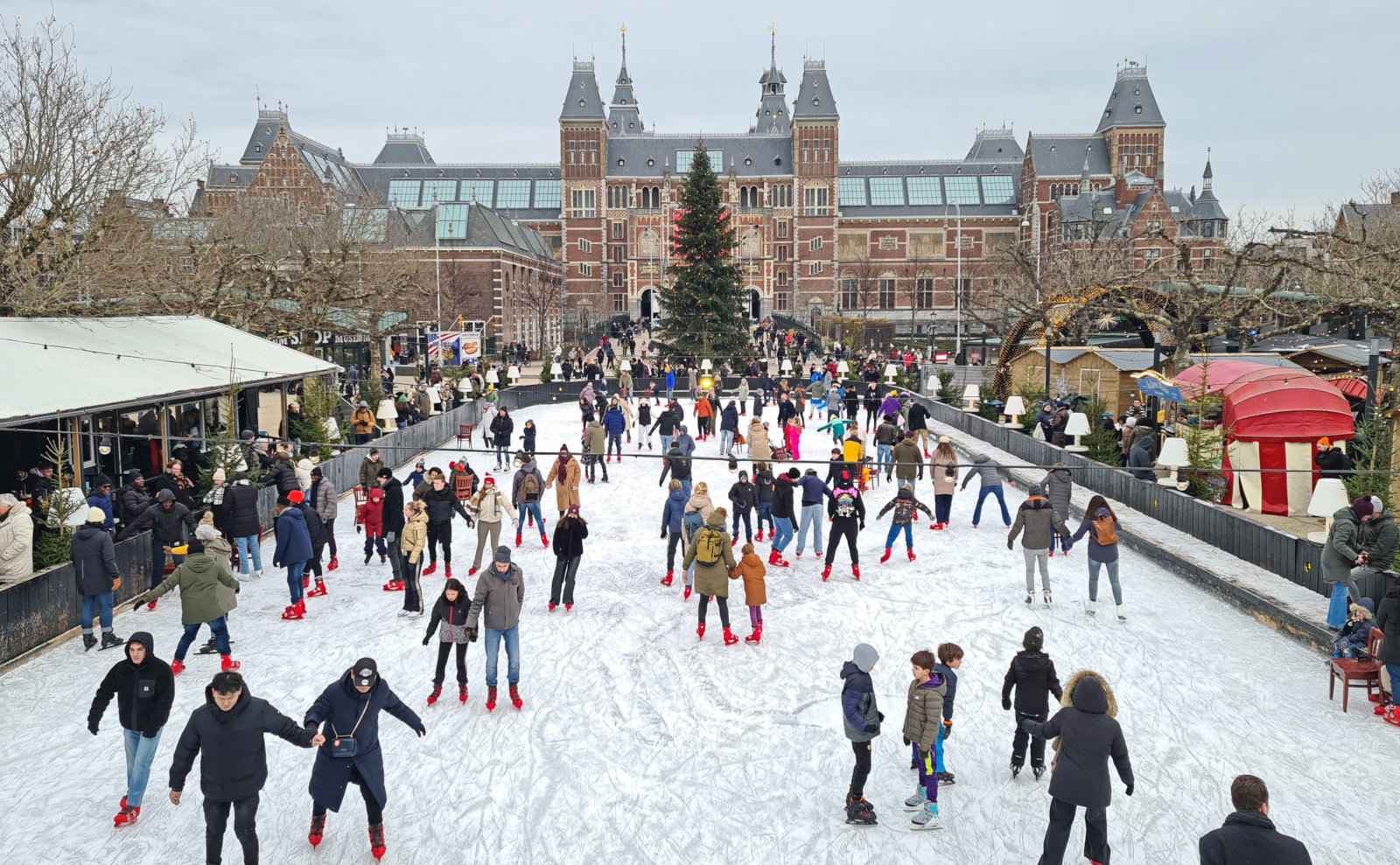 People skating on an ice rink in front of the Rijksmuseum in Amsterdam.